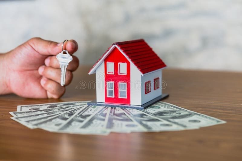 Quelles sont les conditions pour obtenir un prêt consommation à taux zéro 1 main serrant billet avec cle maison